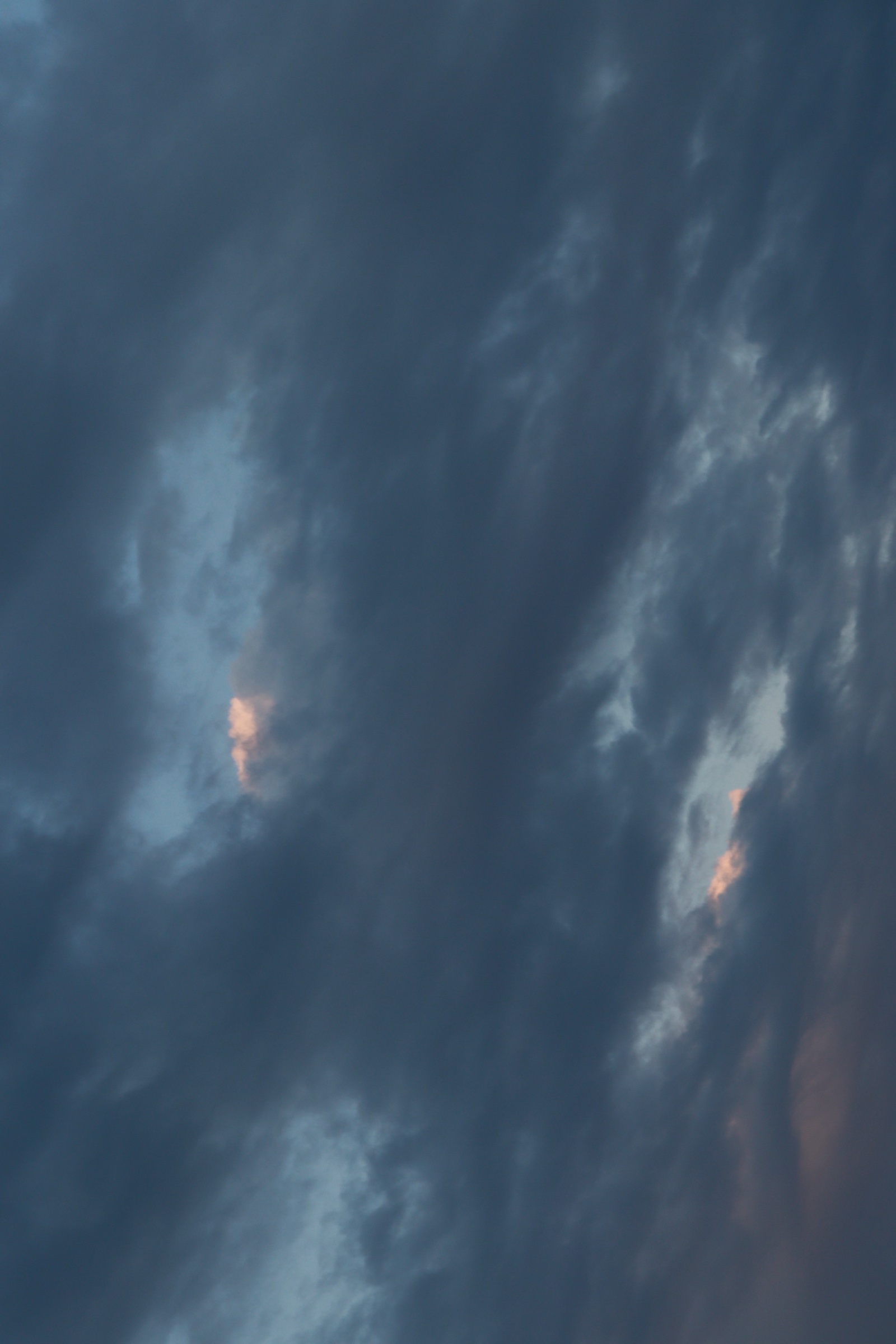Dark storm clouds with blue evening light
